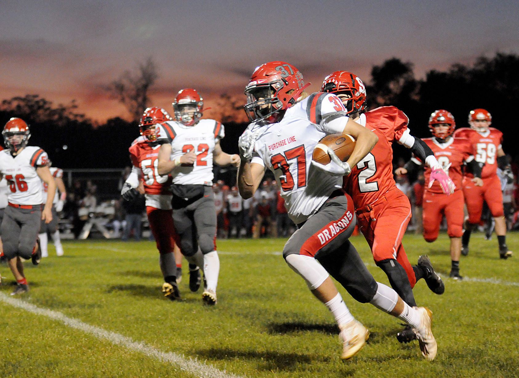 Gazette Photo Gallery: Dragons dominate Trojans